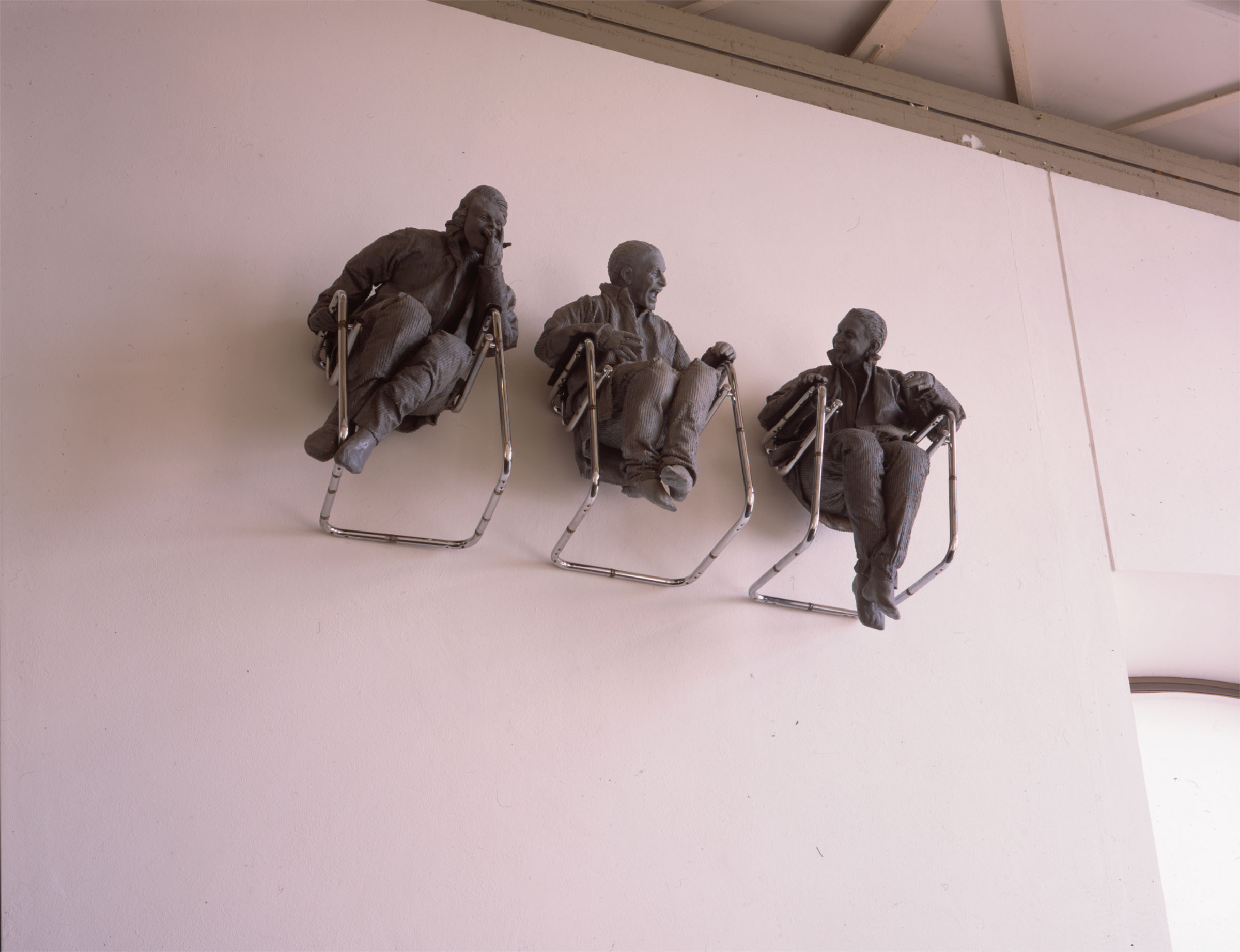 Juan Munoz, Three Seated on the Wall with Big Chair, 2000